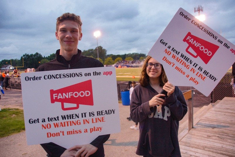 high school students holding fanfood banner